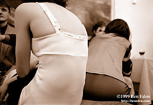 Two Jewish women resting, showing their backs to the camera at a Chanukah (Hanukah) charity ball held in the Rudolph Gallery at Prague Castle, Czech Republic.