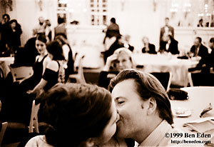 A Jewish young man kisses his fiance while his mother watches in the background at a Chanukah (Hanukah) charity ball held in the Rudolph Gallery at Prague Castle, Czech Republic.