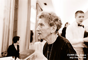 An old Jewish woman queues up for refreshments at a Chanukah (Hanukah) charity ball held in the Rudolph Gallery at Prague Castle, Czech Republic.