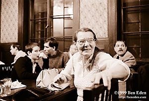 Old Jewish woman looks up from her table at a Chanukah (Hanukah) celebration held in Prague, Czech Republic Jewish Community's eating hall.