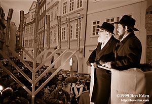 Prague Chabad Rabbi Manis Barash lights the huge outdoor Chanukiah (Hanukiah, Menorah)  on Prague's Male namesti to celebrate the first day of Chanukah (Hanukah).