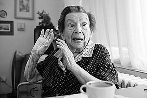 Marie Gardova, a Czech Jewish Holocaust survivor, a former nurse in the Theresienstadt (Terezin) Ghetto, lifts her hands up during a discussion with friends in the Charles Jordan retirement home, Prague.