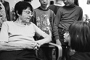 Eliska Rihova, a Czech Jewish Holocaust survivor suffering from Parkinson's disease, converses with schoolchildren as they come to visit her Charles Jordan retirement home in Prague, Czech Republic.