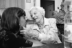 Sarlota Vesela, a Czech Jewish Holocaust survivor, caresses the cheek of Alenka, a caretaker in the Charles Jordan retirement home, during her 82-nd birthday party.
