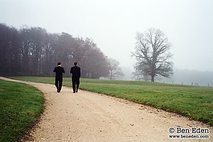 Groom with Best Man strolling through the Park