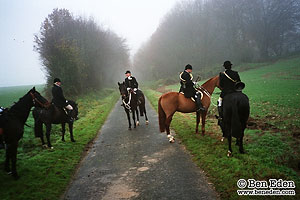 In the saddle, off into the foggy forest