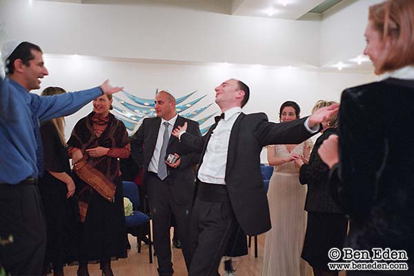 Groom celebrates with friends after the end of the ceremony