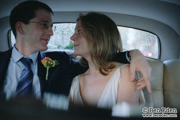 Photograph of an English newlywed couple in a Rolls Royce limousine